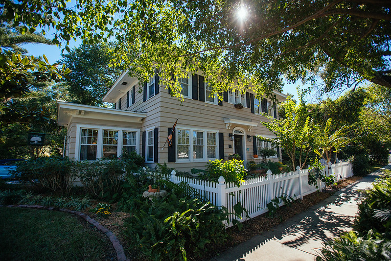 An exterior shot of a two-story St. Pete home within a suburban neighborhood on a sunny day
