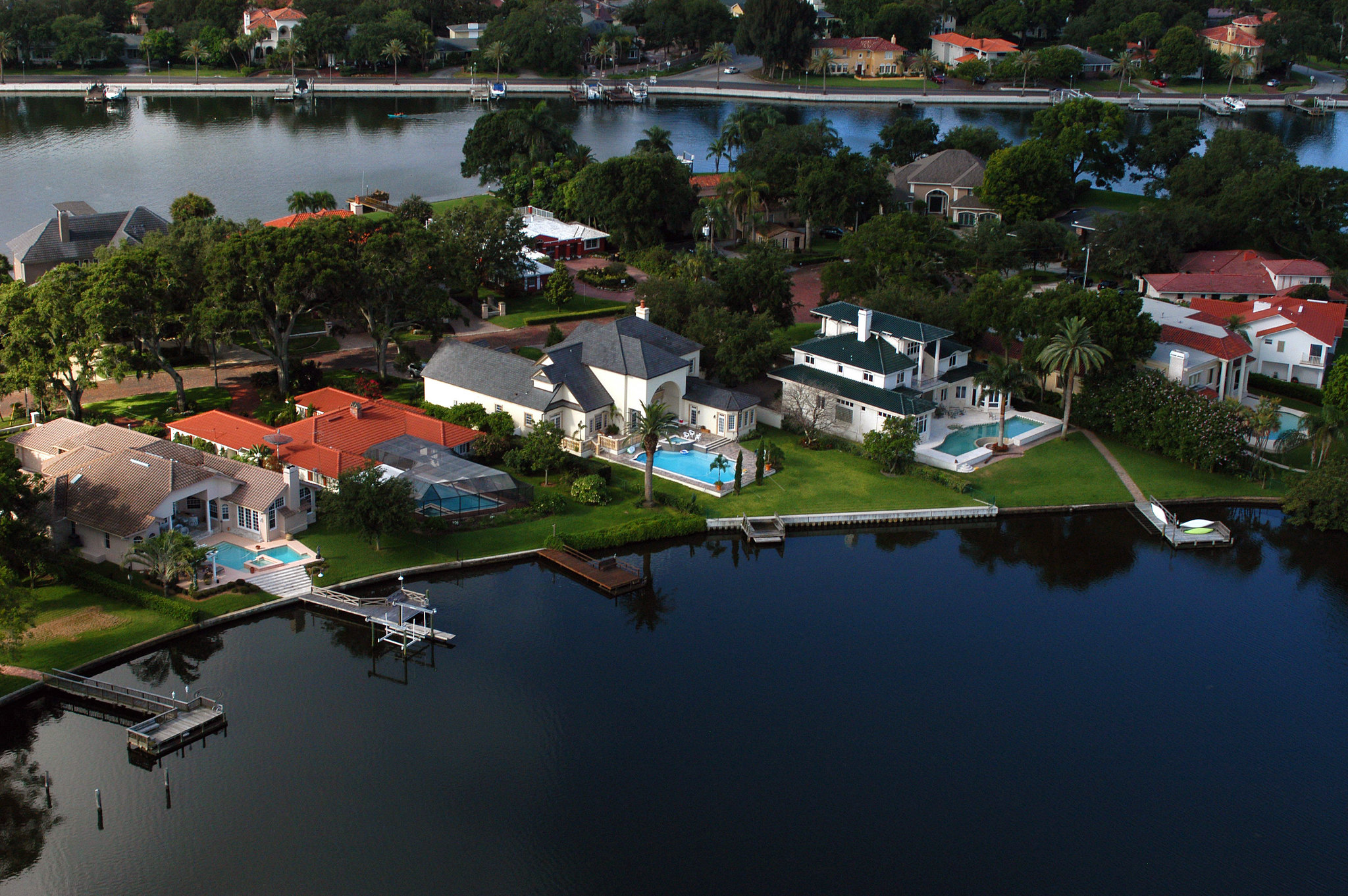 Aerial shot of large houses by the water
